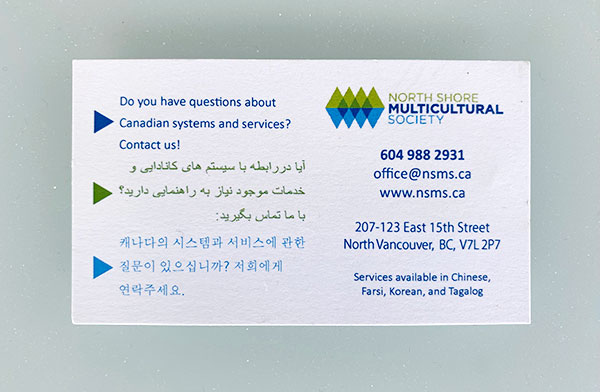 Back of the card showing English, Farsi, and Korean