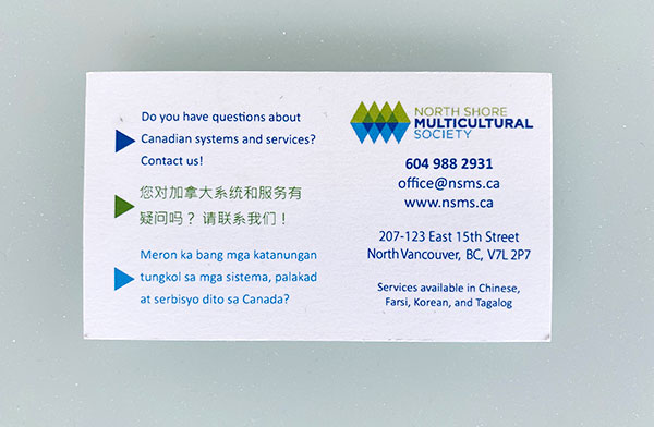 Front of the business card showing English, Mandarin, and Tagalog